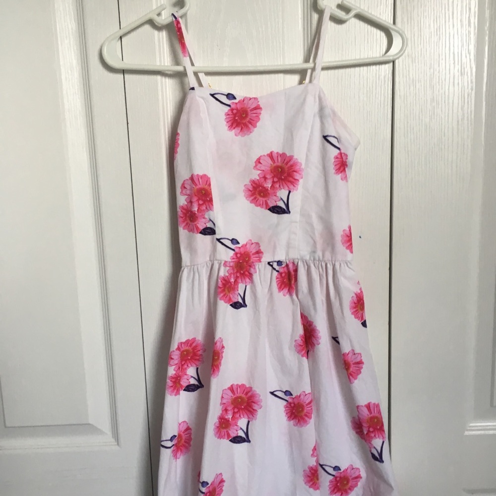 White dress with bright pink floral design